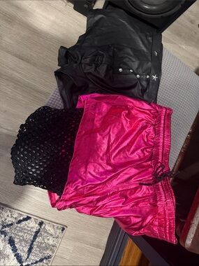 whip, handcuffs, faux leather top, shorts and vest Pink shorts w/netting